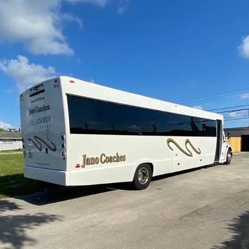 White motor coach for charter bus rental in South Florida — group transportation by Larry's Private Car & Limousine