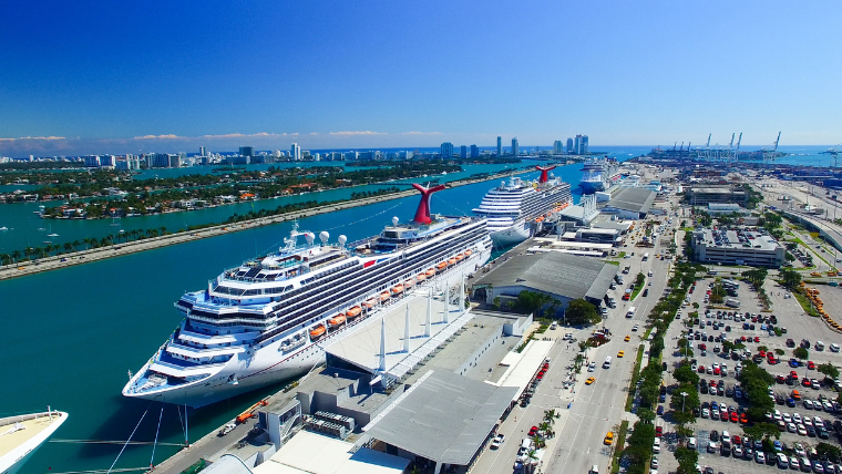 Aerial view of cruise ships docked at Port Miami with cruise terminals and parking areas